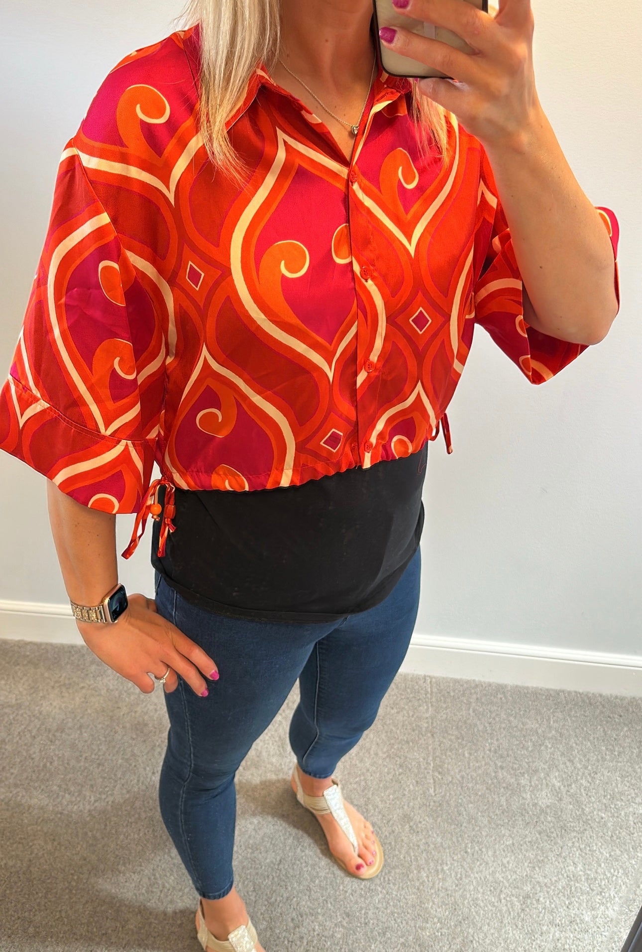 Pink and orange print shirt would fit up to size 12