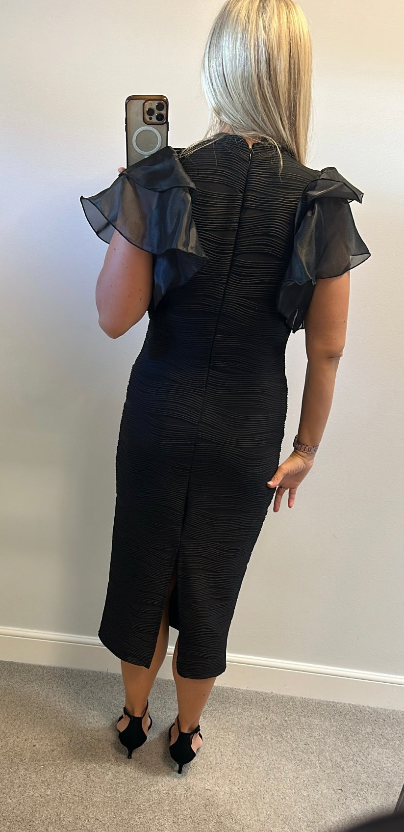 Black ribbed dress with puff sleeves would fit upto size 16