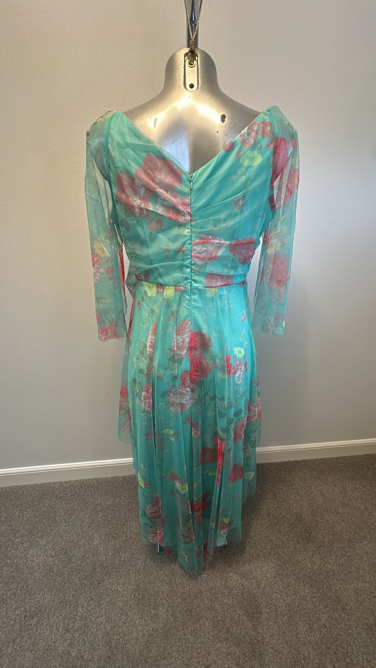 Turquoise floral dress size M would fit upto size 12