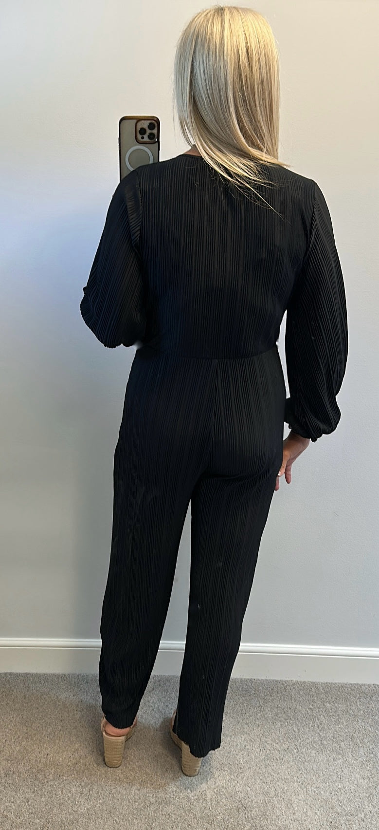Black pleated jumpsuit would fit upto size 14