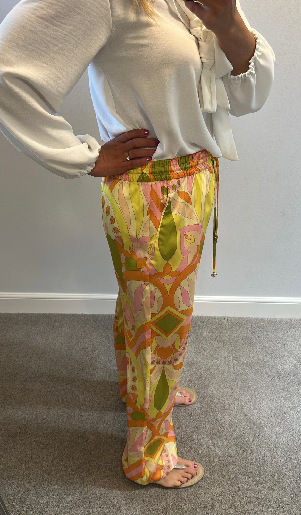 Zara orange print trousers size L would fit upto size 14