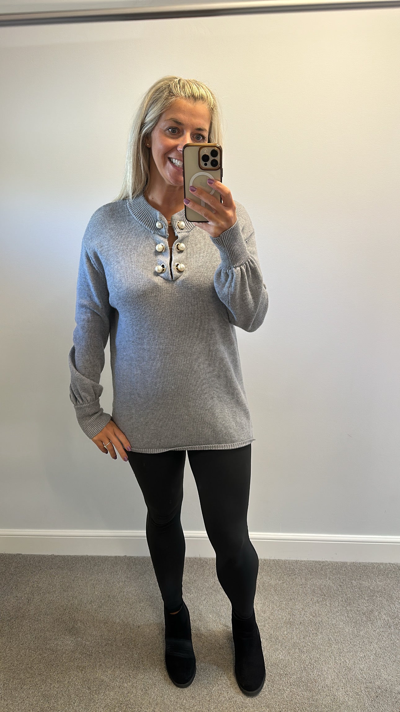 Grey knit jumper would fit upto size 18