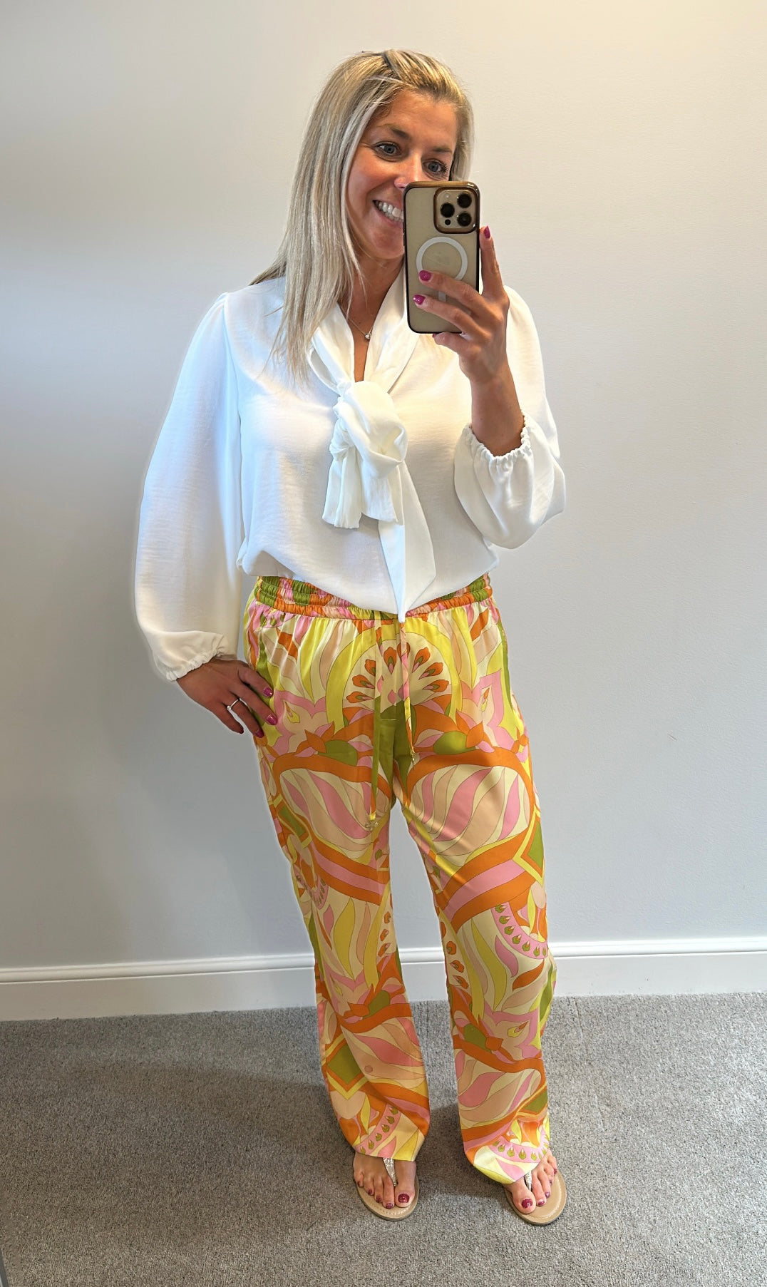 Zara orange print trousers size L would fit upto size 14