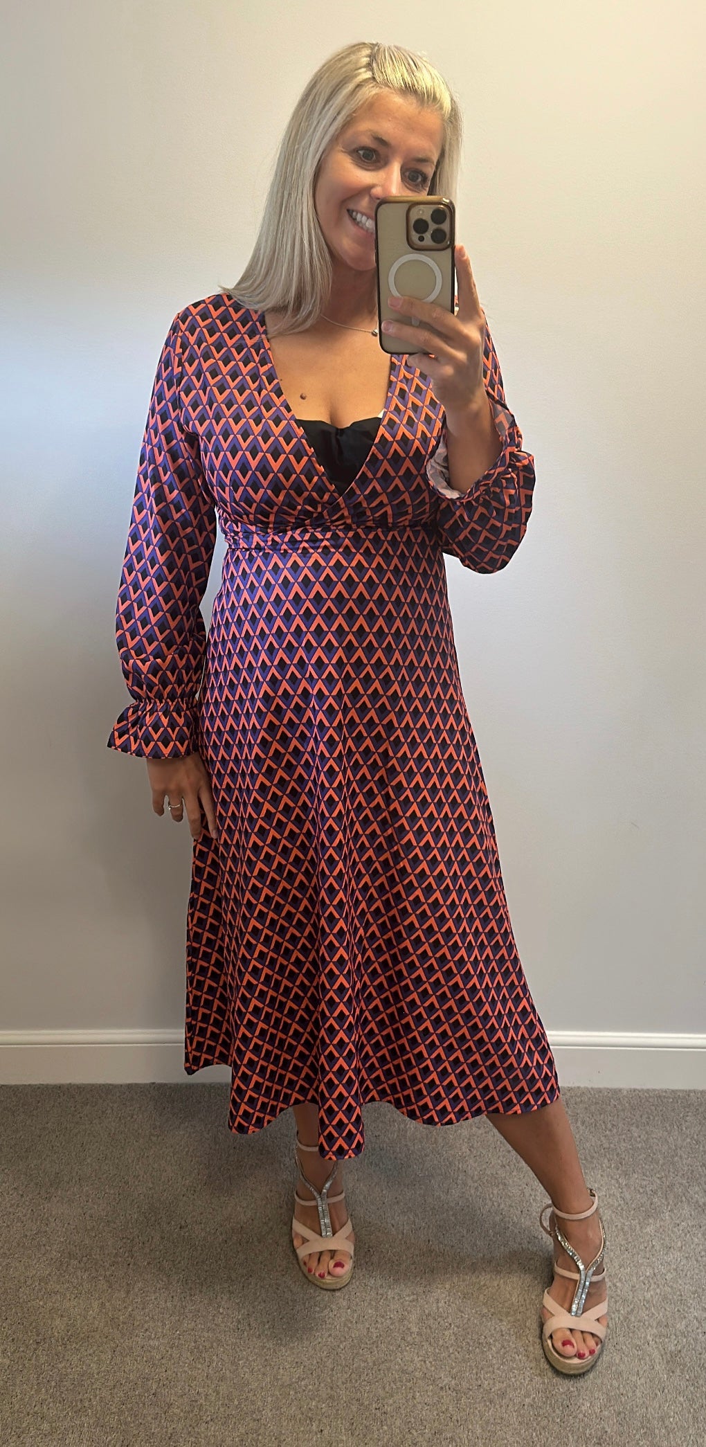 Orange and purple print dress would fit up to size 12