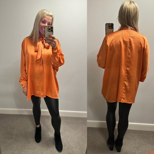 New collection orange silk style pussy bow blouse one size fitting upto size 24 brand new with tags