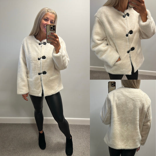 Blue vanilla cream collarless toggle faux fur jacket size M would fit upto size 16 brand new with tags