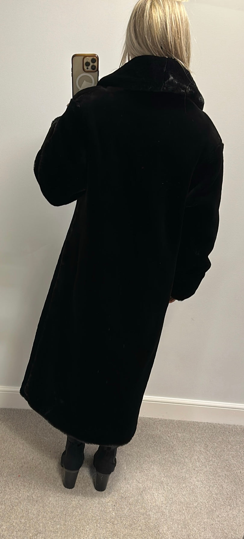 Long black faux fur jacket would fit upto size 16