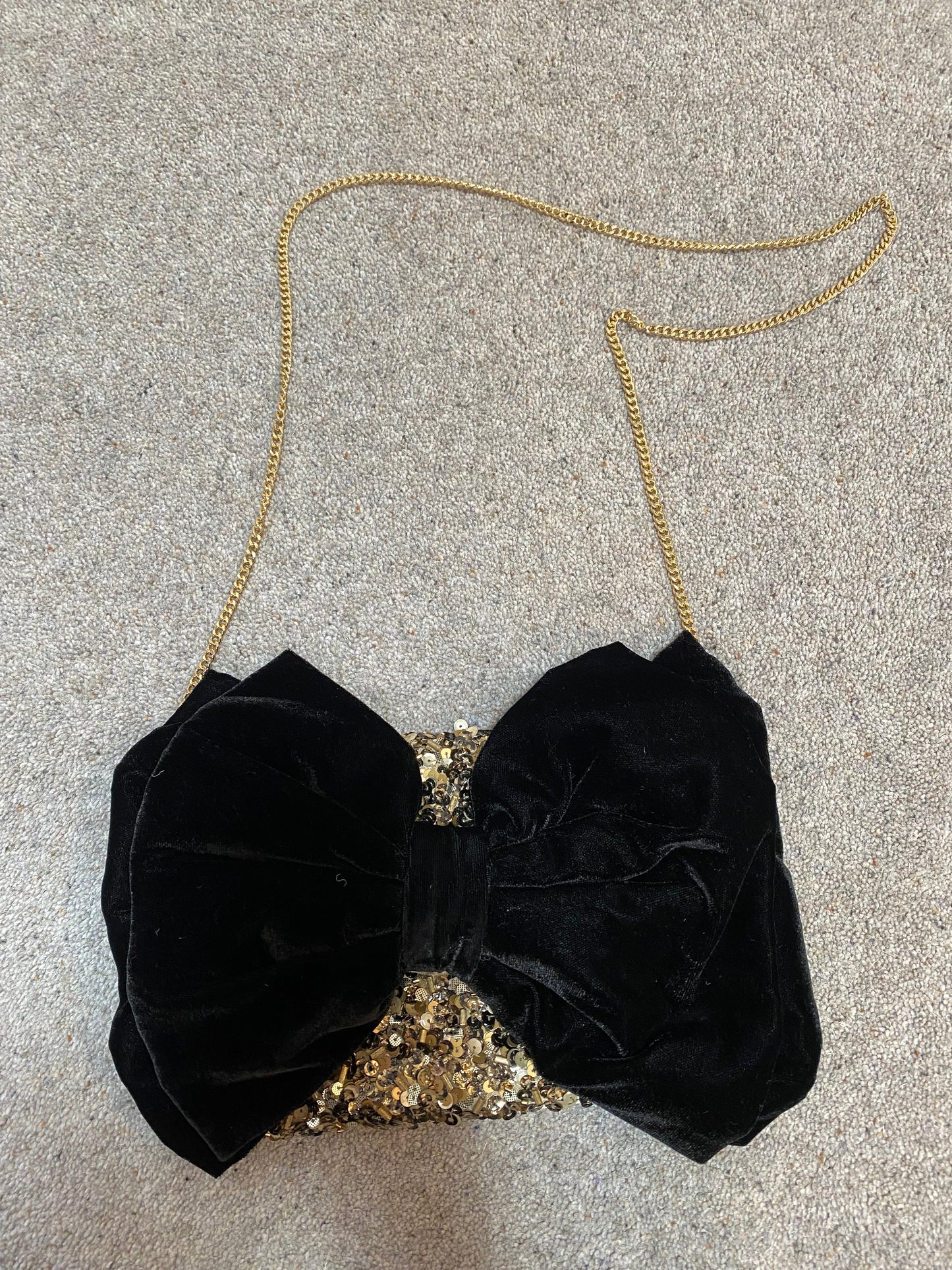 Monsoon gold sequin black bow clutch bag with strap