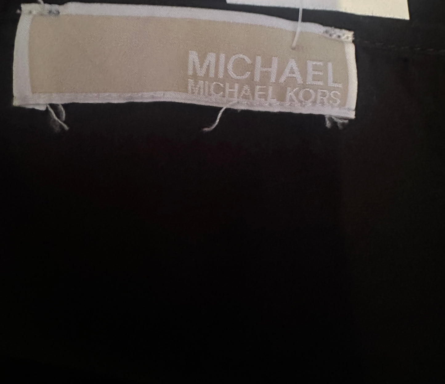 Michael Kors black strappy dress would fit up to size 16