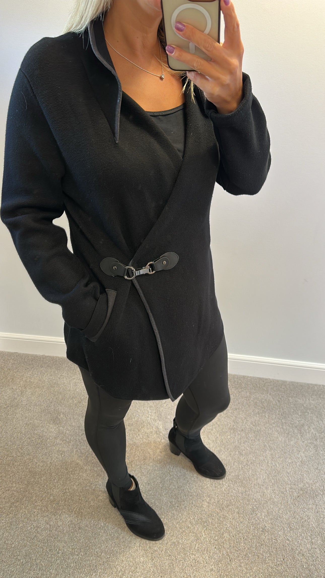 Cristina black top size L/XL would fit upto size 16