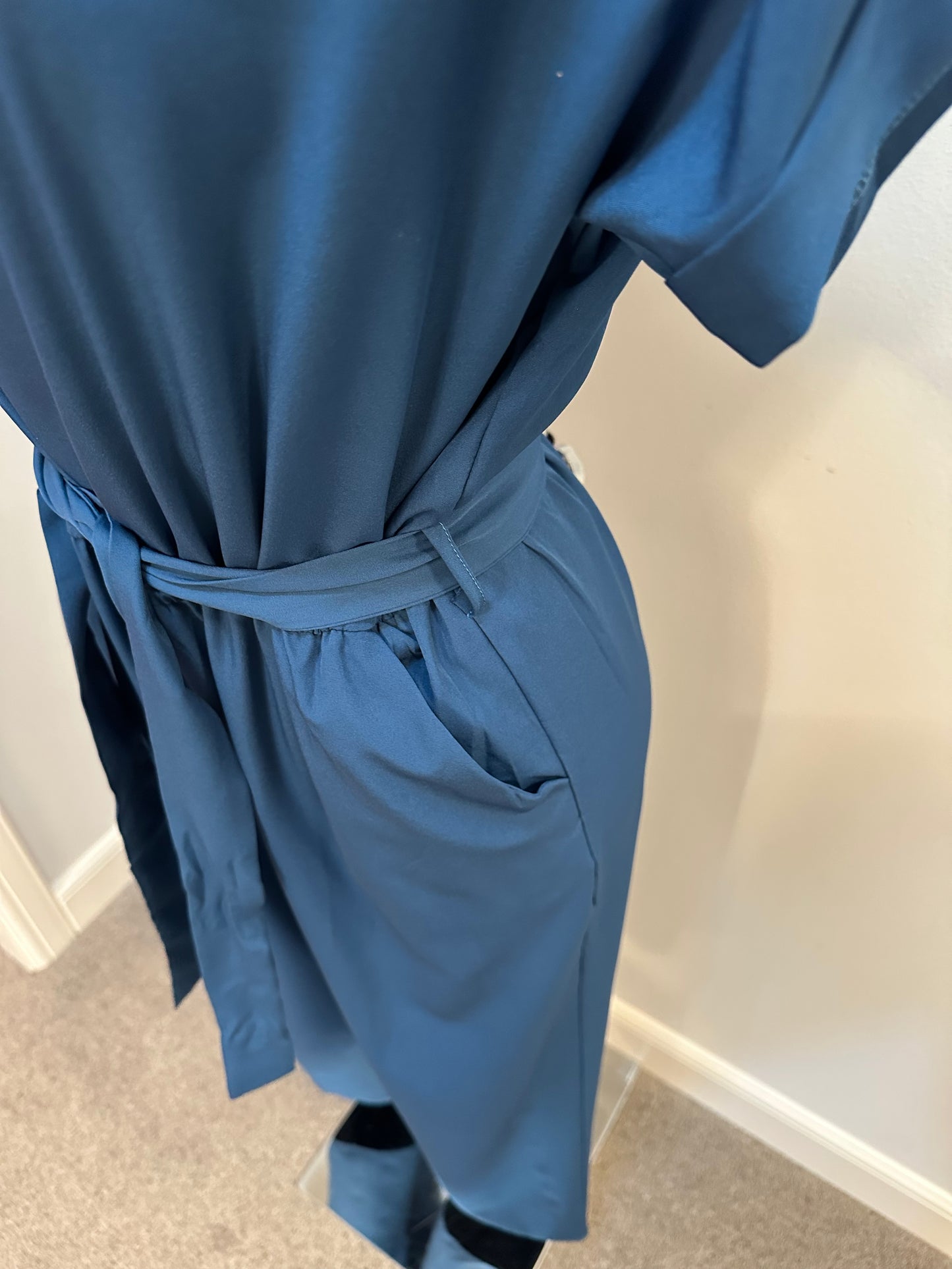 Teal Green jumpsuit with pockets onesize fitting upto size 12