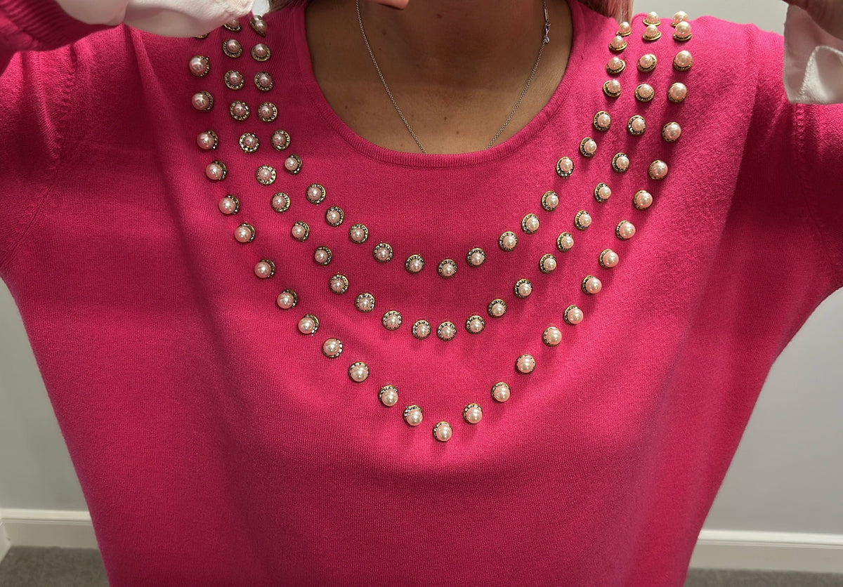 Laetitia Mem pink knit top with pearl v-neck embellishments and white ruffled cuff details one size fitting upto size 18