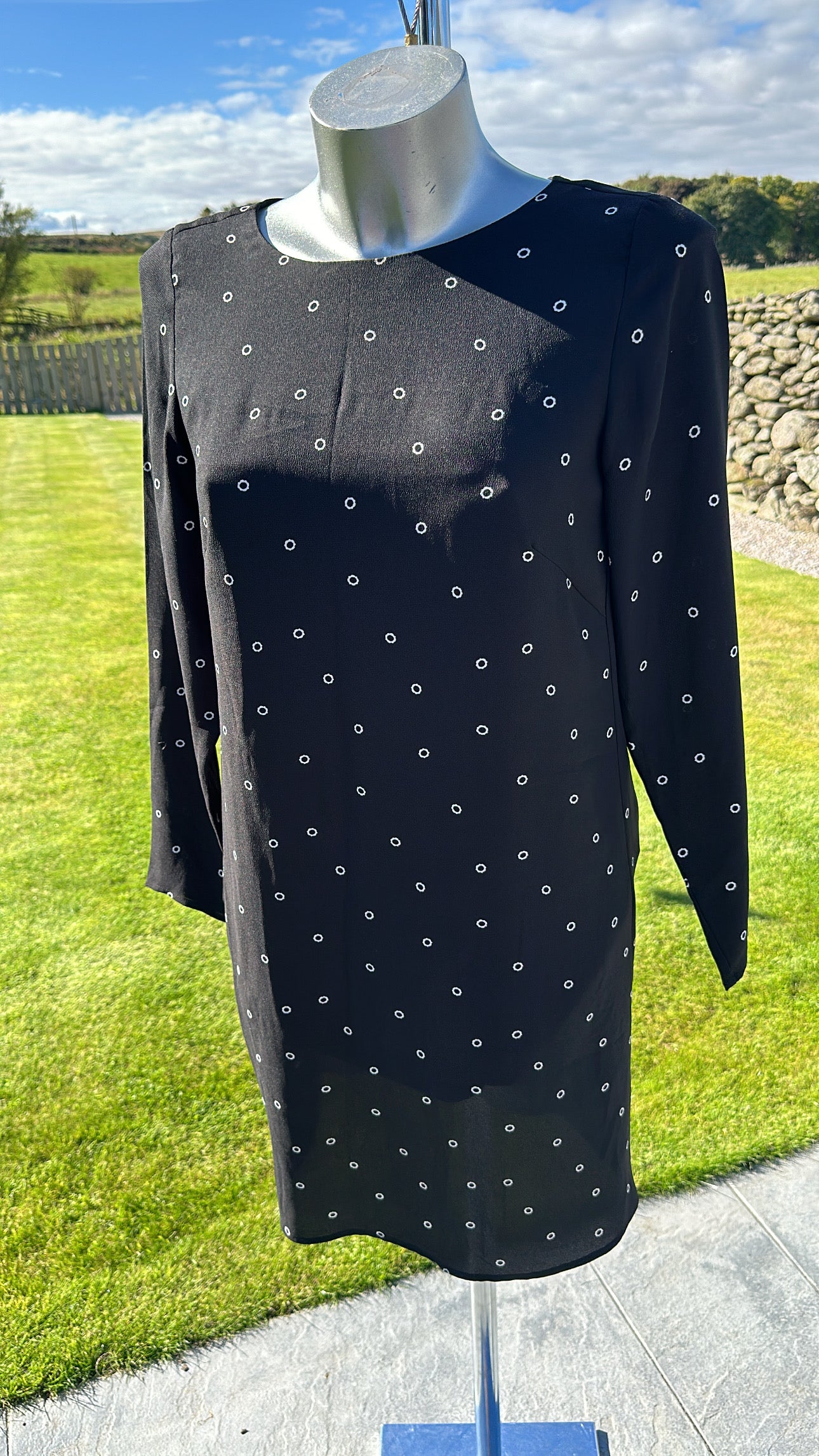 H&M black print dress would fit upto size 10