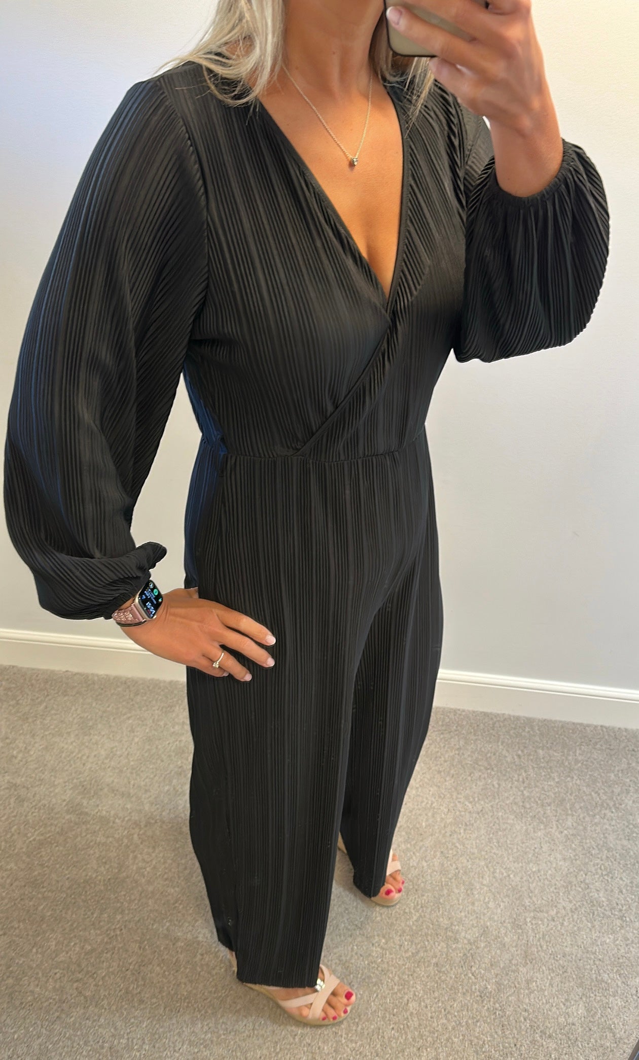Black pleated jumpsuit would fit upto size 14
