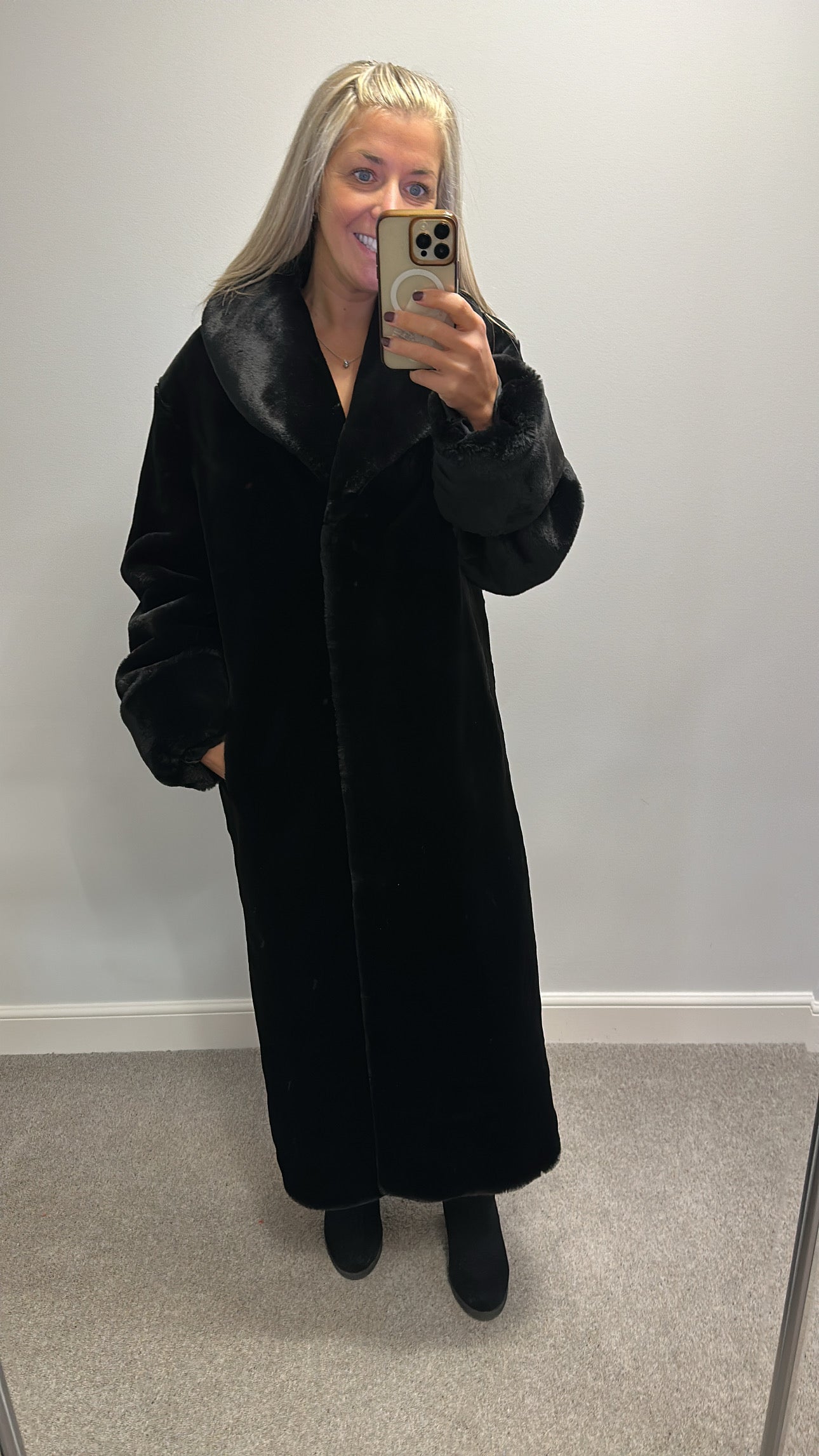 Long black faux fur jacket would fit upto size 16