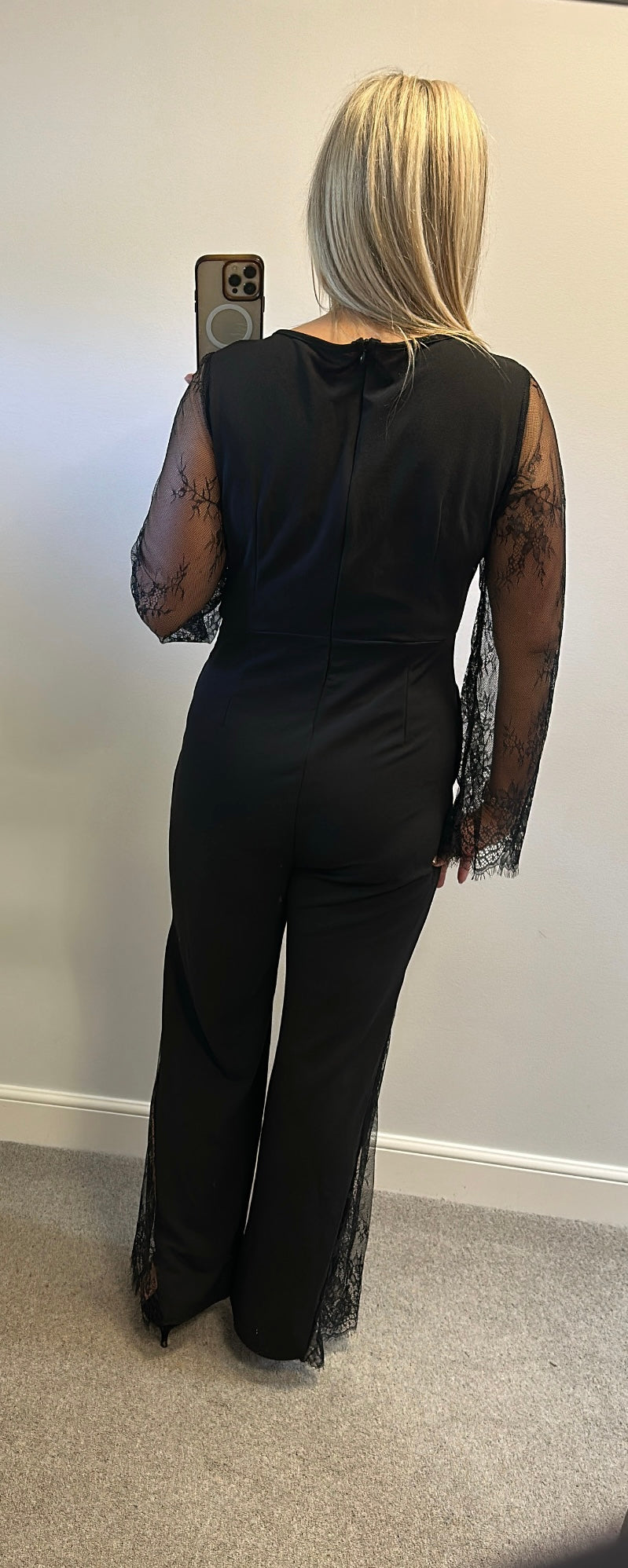 Black lace jumpsuit would fit upto size 14