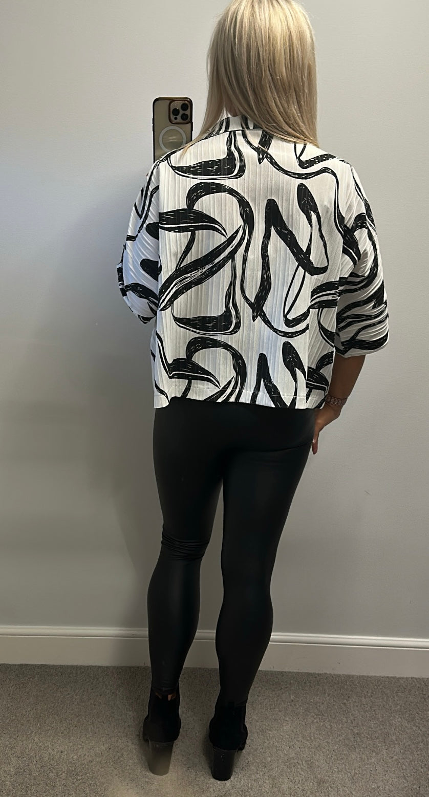 Malissa J white and black print zip top would fit upto size 18