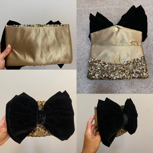 Monsoon gold sequin black bow clutch bag with strap