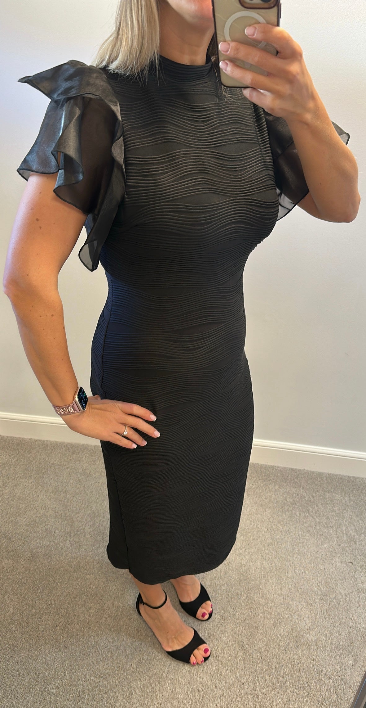 Black ribbed dress with puff sleeves would fit upto size 16