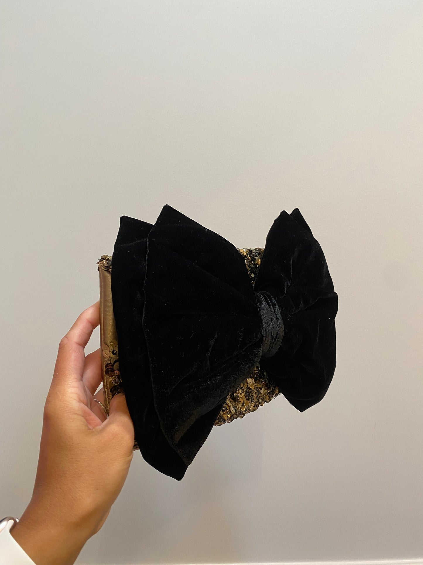 Monsoon gold sequin black bow clutch bag with strap