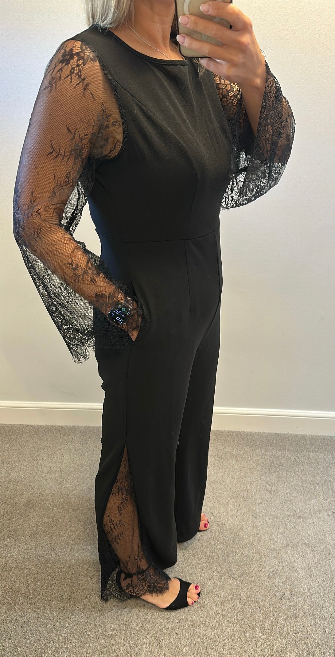 Black lace jumpsuit would fit upto size 14