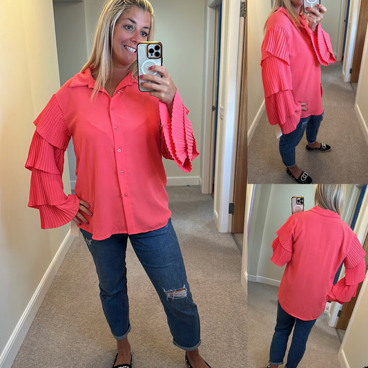 Coral fluted sleeve blouse one size would fit upto size 18 brand new with tags