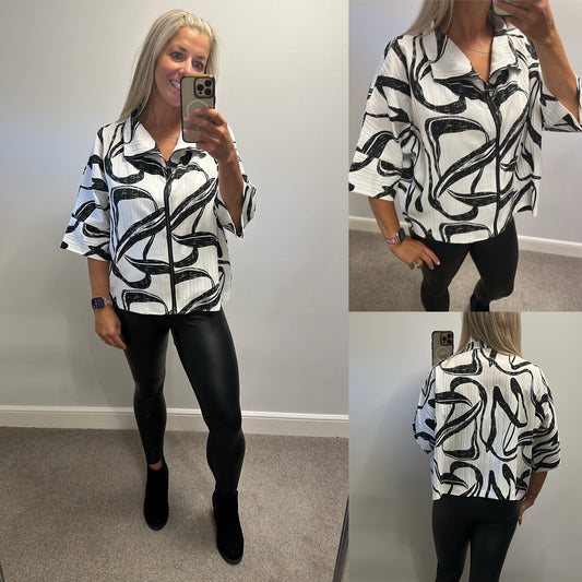 Malissa J white and black print zip top would fit upto size 18