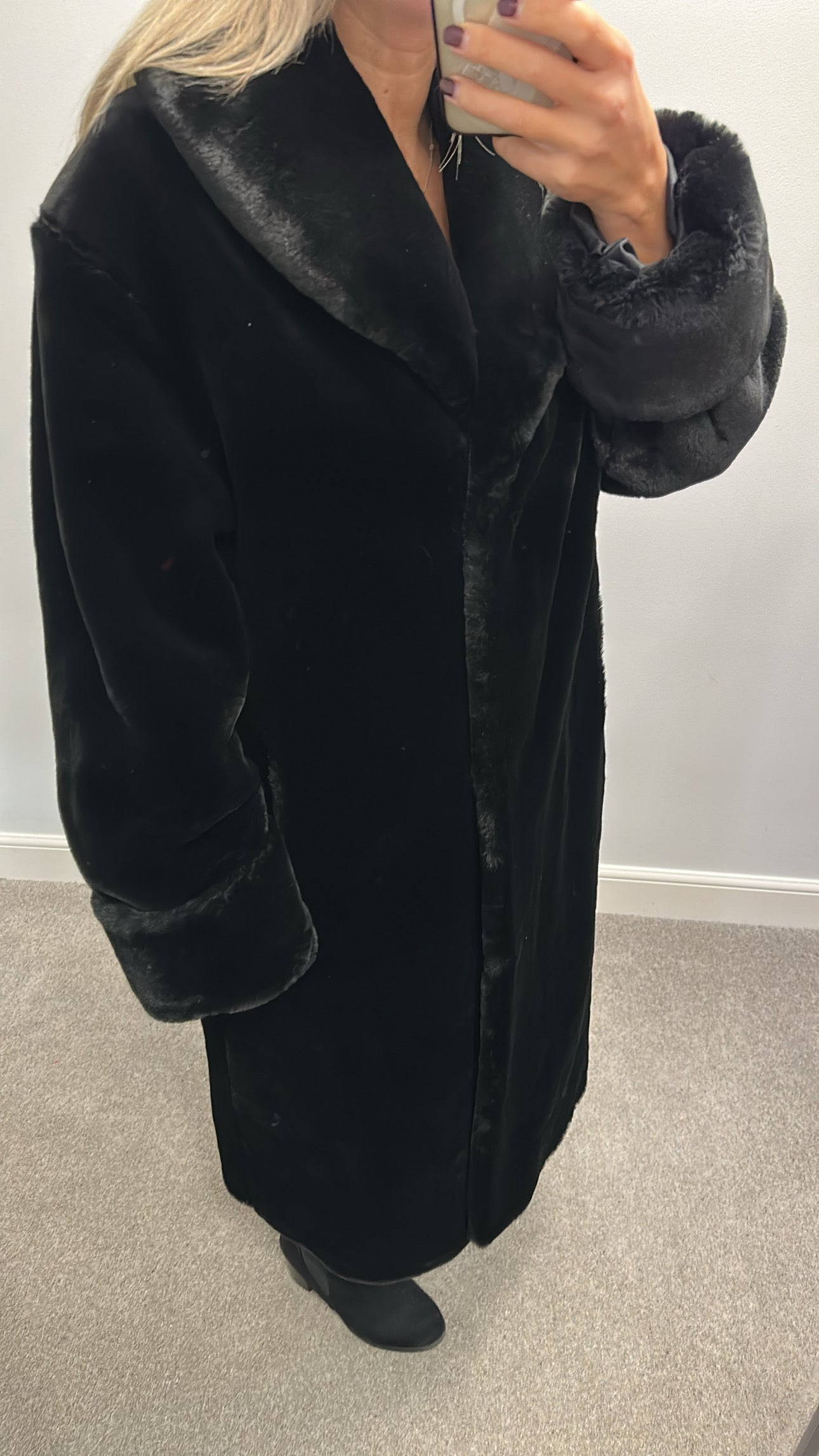 Long black faux fur jacket would fit upto size 16