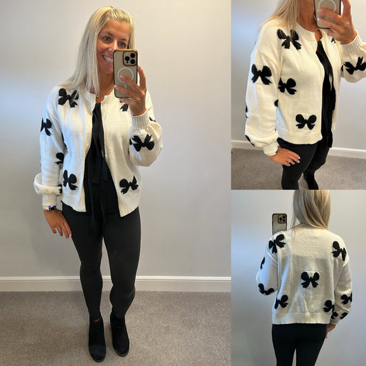 Bow knit jumper one size fitting upto size 18 brand new without tags