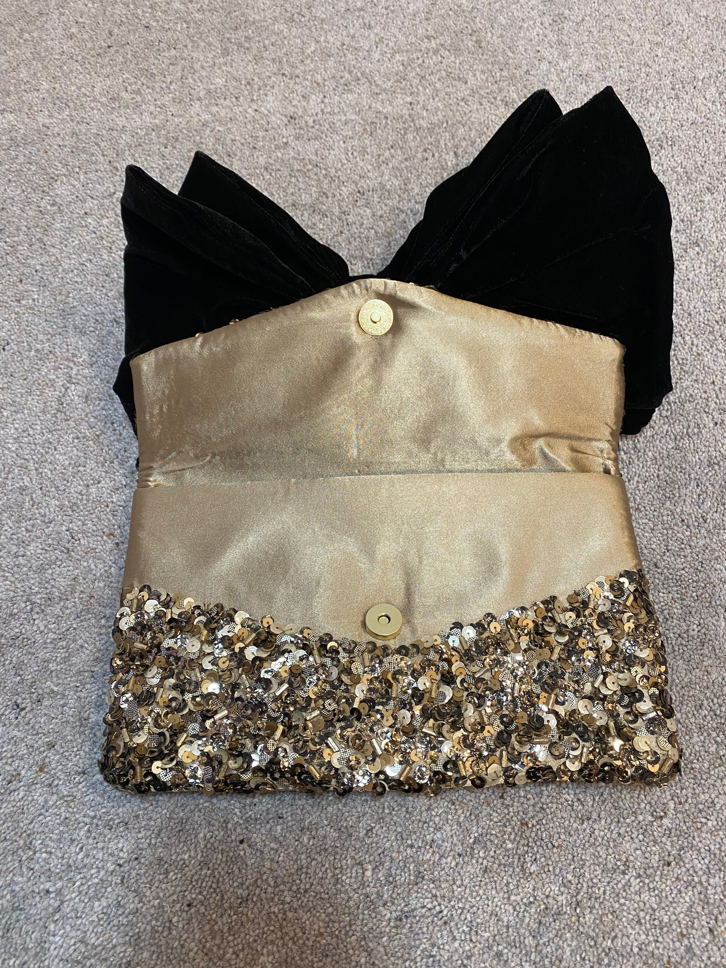 Monsoon gold sequin black bow clutch bag with strap
