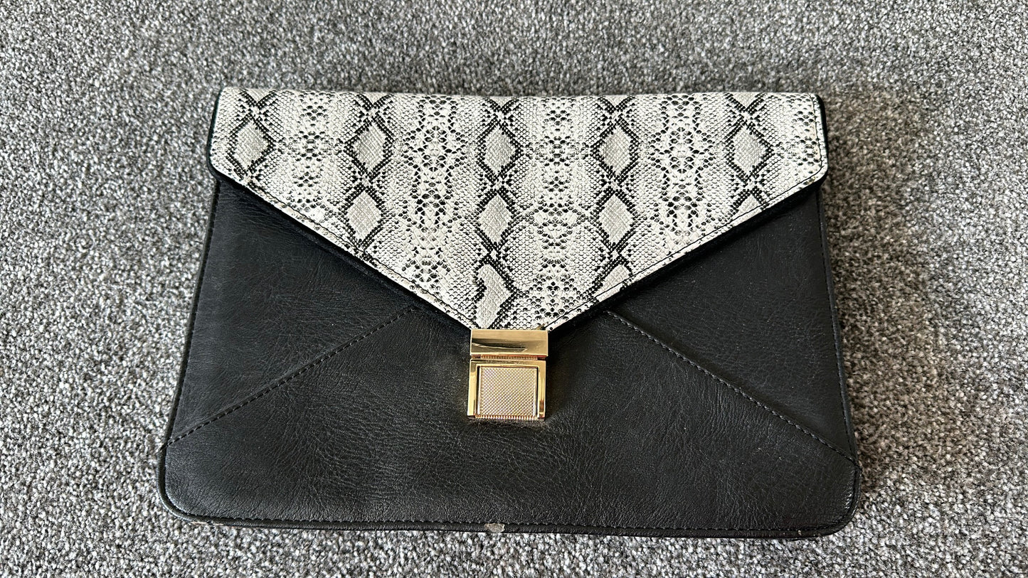 Dune black snakeskin print envelope clutch