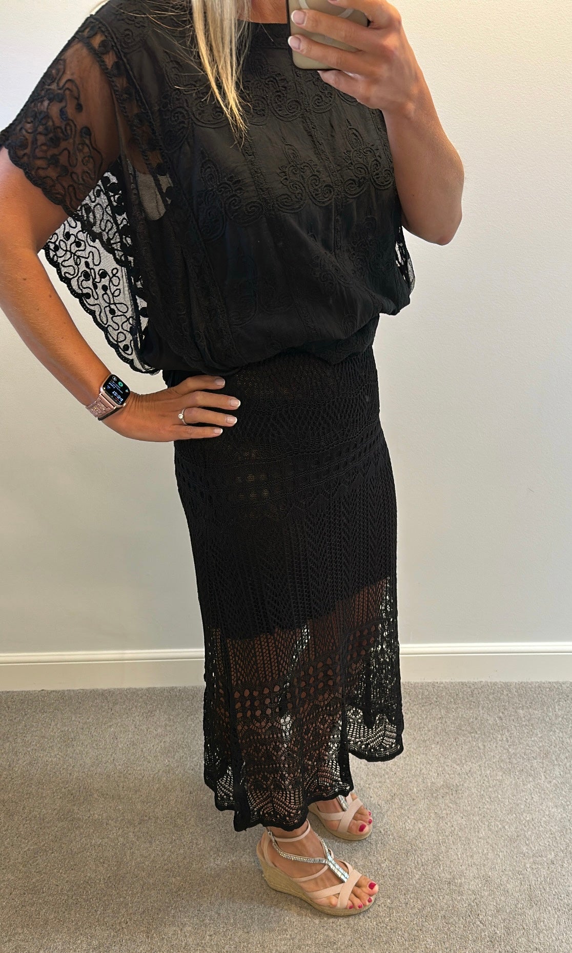 Black lace skirt size L would fit upto size 14